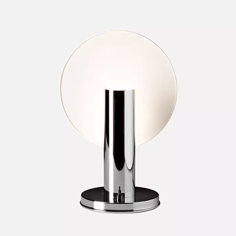 A chrome table lamp with a globe shape shade, featuring a reflective metal base and a white diffuser.